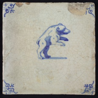 Animal tile, upright bear to the right in blue on white, corner motif ox's head, wall tile tile sculpture ceramic earthenware