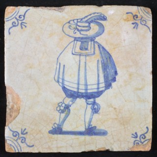 Figure tile, blue with nobleman seen on the back, wide cape and big hat with plume, corner pattern ox head, wall tile