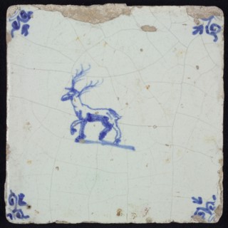 Animal tile, stepping deer to the left, in blue on white, corner motif oxen head, wall tile tile sculpture ceramic earthenware