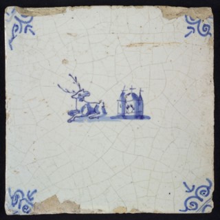 Animal tile, lying deer to the left and right next to it church, in blue on white, corner motif oxen head, wall tile
