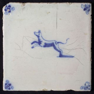 Animal tile, jumping dog to the left, in blue on white, corner motif spider, wall tile tile sculpture ceramic earthenware glaze