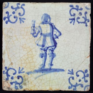 Occupation tile, blue with nobleman seen from behind, with roll of parchment in hand, corner motif voluut, wall tile