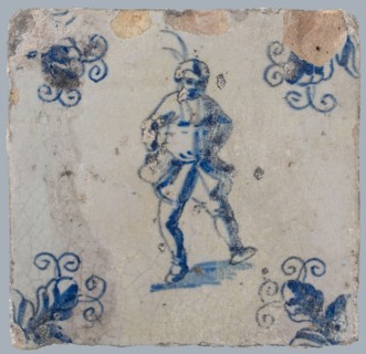 Figure tile, blue with dancing man with beret with plume on the head, corner motif, wall tile tile sculpture ceramic earthenware