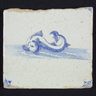Animal tile, unknown fish in water to the left, in blue on white, corner motif of ox's head, wall tile tile sculpture ceramic