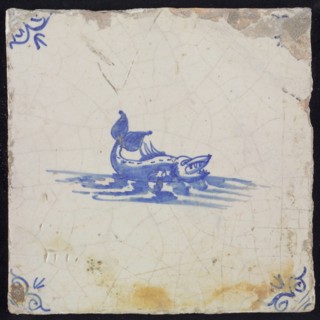 Animal tile, sea-based in water to the right, in blue on white, corner motif of ox-head, wall tile tile sculpture ceramic