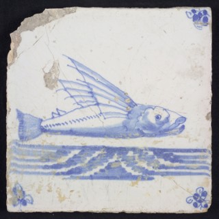 Animal tile, flying fish above running water to the right, in blue on white, corner motif spider, wall tile tile sculpture