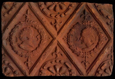 Hearthstone, from Antwerp Belgium, without frame, with male and female heads, hearth part soil foundry brick, baked hearth