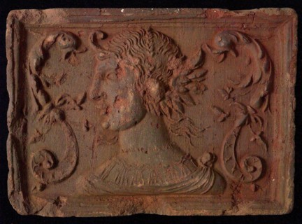 Hearthstone, from Antwerp Belgium, with narrow frame, with woman's head and dolphin's fads, hearth fireplace component ceramics