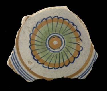 Fragment of the majolica dish, polychrome, concentric circles containing rosette, plate crockery holder soil find ceramic