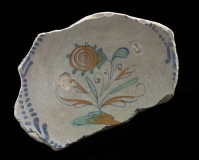Fragment majolica dish, polychrome, flower with swaying leaves on piece of ground, plate crockery holder soil find ceramic