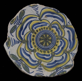 Fragment majolica dish, yellow, green and blue on white, with stylized rose (Tudor rose?), dish plate crockery holder earth