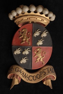 Carved wooden crowned coat of arms including the name M.G. van Coopstad, coat of arms information form carvings sculpture