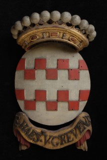 Carved wooden crowned coat of arms including the name E. Haest. V. Grevenb., coat of arms information form carvings sculpture