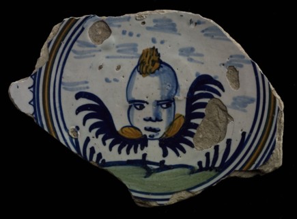 Fragment majolica plate, polychrome, winged cherub head, floating above ground, plate crockery holder soil find ceramic