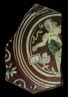 Fragments Werra plate, mirror decoration Eva with apple in hand, year 1594, light yellow and green glaze, border with stars and