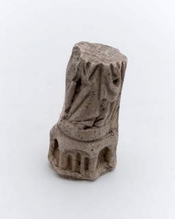 Part of pipe image, person, saint in pleated robe on pedestal, sculpture visual material soil finds ceramic pipe earth, in mold