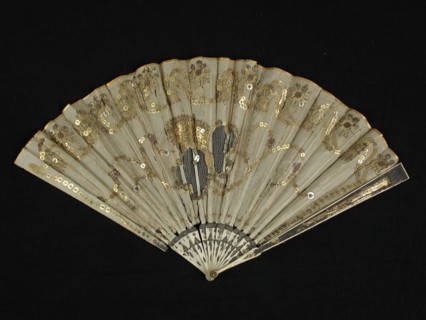 Folding fan with bone frame with foil, fan blade of cream-colored silk with tulle incrustation and gold colored sequins, folding