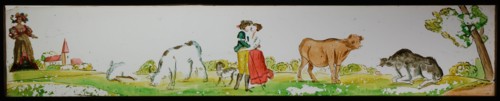 Hand-painted glass lantern plate in wooden frame, with kissing couple in landscape with cows, slide slide slideshoot images