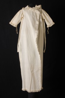 Long white baby coat of rib cotton, piqué, trimmed along all edges with ruffles of mull, jacket coat baby clothing children's