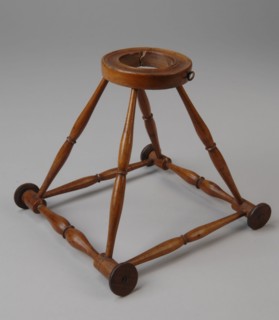 Miniature wooden walking frame with square base, pyramid shaped ascending, round wooden waistband with removable piece