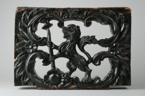 Ornament of wagon, carved lion with spear and hat, ornament part woodcarving sculpture sculpture wood paint, Ornament