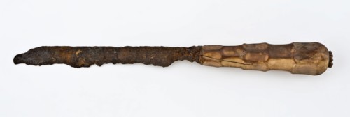 Knife with elongated narrow blade and legs decorated with hexagonal surfaces, knife cutlery soil find bone iron metal