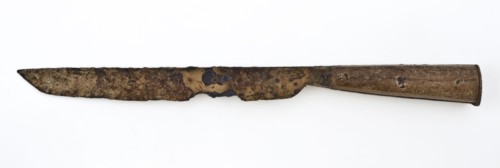 Knife with elongated iron blade and wooden handle, consisting of two plates, knife cutlery soil find iron wood metal, archeology