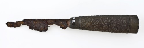 Blade with short blade and wooden handle with round cross section around which decorated metal sleeve, knife cutlery soil find