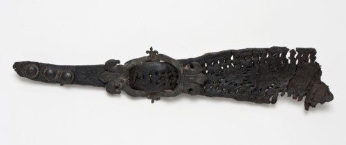 Fragment leather shoe strap with pewter ornamental buckle and fittings, buckle fastener component soil find leather tin metal