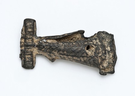 Tin flute or artefact with simple relief decoration, artifact soil find tin metal, cast Pointed object of tin. Decorated