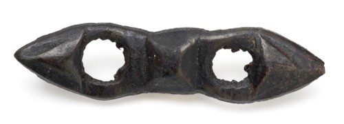 Elongated bronze fittings with two round openings, clothing accessory clothes batter ground find bronze copper metal, cast