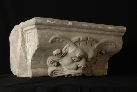Console with devil's head, console building element sandstone stone, sculptured bombardment Rotterdam City Triangle Newport