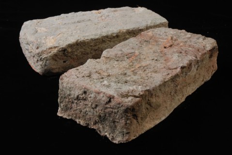 Two gray-red bricks from the tower or wall that were originally connected to the Schiedam gate, brick building material earth