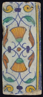 Border tile, flower decoration in blue, yellow and green, upper and lower edge blue and yellow, border tile wall tile tile