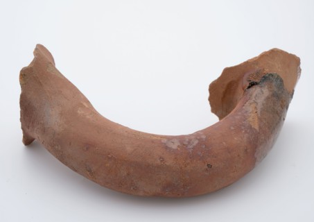 Fragment of red earthenware, partly glazed, fragment crockery holder kitchen utensils earthenware ceramics earthenware glaze