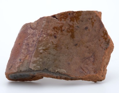 Fragment of red earthenware, partly glazed, fragment crockery holder kitchen utensils earthenware ceramics earthenware glaze
