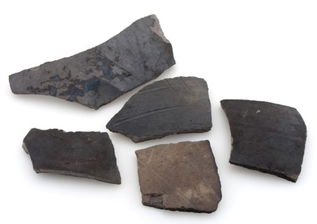 Fragments of cooking pots, dark earthenware, decorated with incised lines, cooking pot crockery holder kitchen utensils fragment