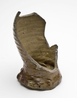 Foot of stoneware drink jug or cup of brown and gray mottled glaze, cup drinking utensils tableware holder fragment soil found