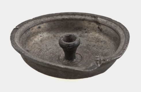 Small tin lid, lid closure soil found metal tin, molded tin lid. Curved flat and protruding edge In the middle at the bottom