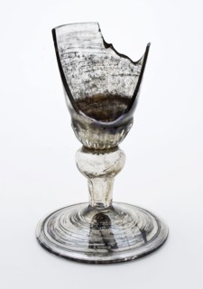 Fragment of the foot, trunk and part of the calyx goblet, drinking glass drinking utensils tableware holder soil find glass, cm