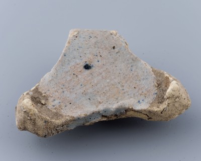 Fragment of prune, soil found ceramic earthenware glaze lead glaze, baked Triangular flat object with points on the three