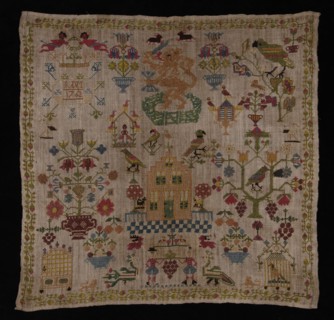 Trademark worked in cross-stitch with colored silk on loosely woven cream-colored linen, IVDM 1762, sampler embroidery