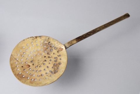 Skimmer with flat handle, made entirely of brass, skimmer kitchenware soil find brass metal, archeology Rotterdam railroads Soil
