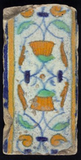 Border tile, flower decoration in blue, yellow and green, upper and lower edge blue and yellow, border tile wall tile tile