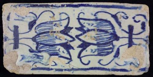Blue border tile, waving floral pattern with tulips, above and below blue border, edge tile wall tile tile sculpture ceramic