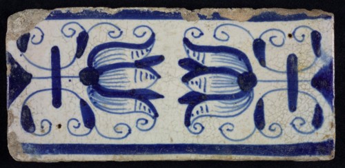 Blue border tile, waving floral pattern with tulips, above and below blue border, border tile wall tile tile sculpture ceramic