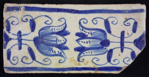 Blue border tile, waving floral pattern with tulips, above and below blue border, border tile wall tile tile sculpture ceramic