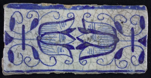 Blue border tile, waving floral pattern with tulips, above and below blue border, border tile wall tile tile sculpture ceramic