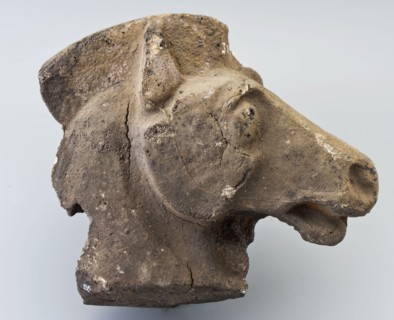 Stone stylized horse head, fragment of image, sculpture footage fragment foundations stone, chopped archeology Lek Rotterdam