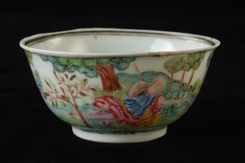Cup of cup and saucer with lying woman and in bushes hidden man in landscape, cup and saucer drinking utensils tableware holder